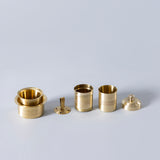 brass coffee filter with mini glass and bowl.