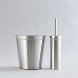 Shiny stainless steel waste bin and brush holder combo.