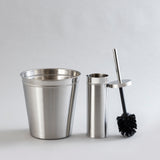 Shiny stainless steel waste bin and brush holder combo.