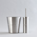 Shiny stainless steel waste bin and brush holder combo.